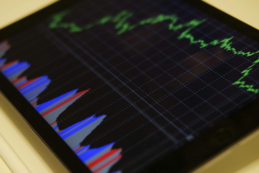 pexels-photo-186461-186461-1 Close-up of a tablet displaying stock market analysis with colorful graphs.